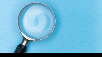 magnifying glass for search on a blue background