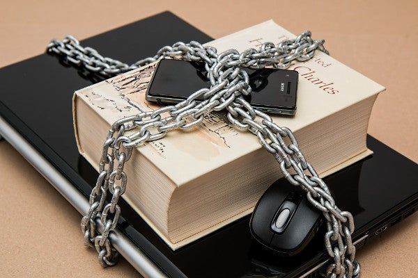 A padlocked laptop and smartphone A padlocked laptop and smartphone