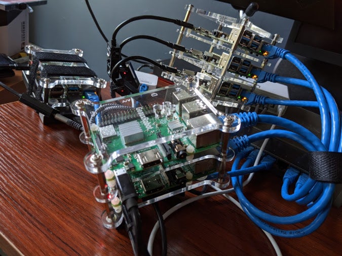 Raspberry Pis stacked up in cluster cases Raspberry Pis stacked up in cluster cases